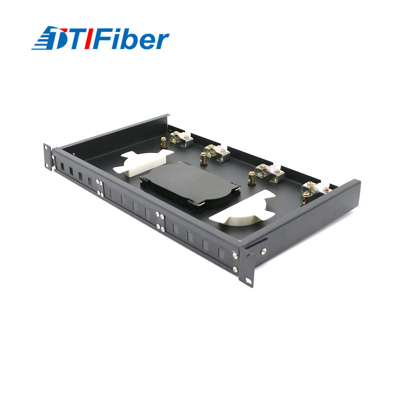 Outdoor fiber terminal box open showing adapters and splice tray